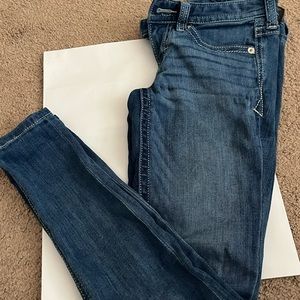 Jeans have been worn frequently, but are still in good shape. Size 00S
